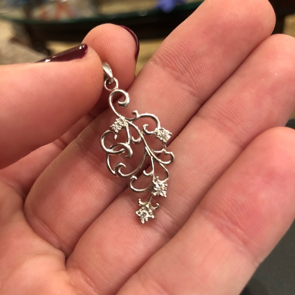 Silver and diamond charm